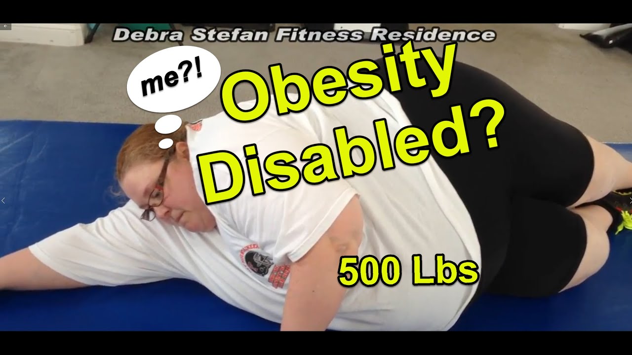 Participant weighing 500 pounds performing a floor mobility exercise at an obesity fitness retreat