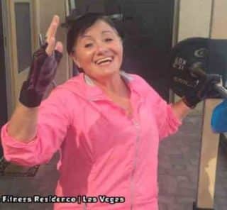 Senior woman celebrating a strength training session at Vegas Fitness Retreats in Las Vegas.